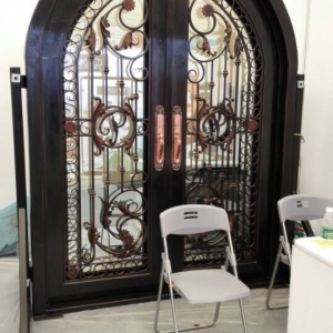 Arched wrought iron door design ornate ironwork door design with sidelite and lamps